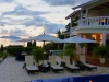 pool. sunloungers and sunset